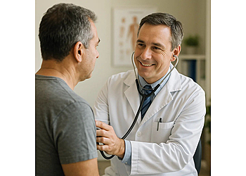 Adrian M Perez, MD Adrian M Perez, MD - Hialeah, FL Primary Care Physicians - Doctor With Patient Image