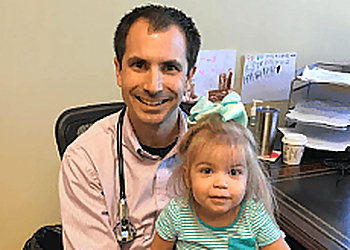Blake W. Barnes, MD, FAAP - Columbia, MO Pediatricians - Doctor With Patient Image