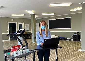 Brittany Powers Berlinrut, PT, DPT, FAAOMPT, CD - PHOENIX PHYSICAL THERAPY, INC - Columbia, SC Physical Therapists - Doctor Working Image