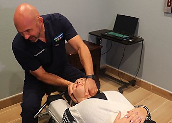 Dr. R. Matthew George, DC - Killeen, TX Chiropractors - Doctor With Patient Image