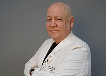 Carlos Santos, MD - Miramar, FL Sleep Clinics - Doctor With Patient Image