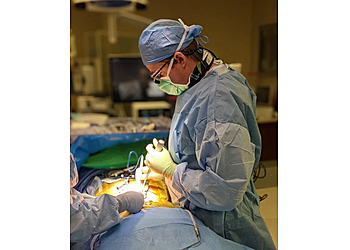 Colin C. Buchanan, MD - Aurora, CO Neurosurgeons - Doctor Working Image