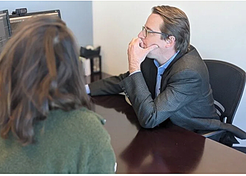 Colin C. Buchanan, MD - Aurora, CO Neurosurgeons - Doctor With Patient Image