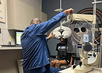 David J. Baptiste, OD - EL PASO OPTICAL CENTER - El Paso, TX Pediatric Optometrists - Doctor Working Image