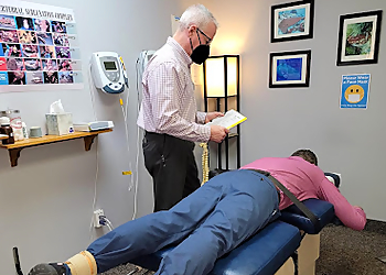 Dr. Christopher Piering, DC - Syracuse, NY Chiropractors - Doctor With Patient Image