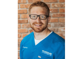 Cedar Rapids chiropractor Dr. Cody Scharf, DC - Thrive Care