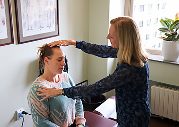 Dr. Jacalyn Buettner, DC - San Francisco, CA Chiropractors - Doctor With Patient Image