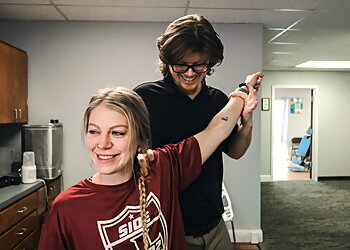 Dr. Taylor Langebartels, DC - Broken Arrow, OK Chiropractors - Doctor Working Image