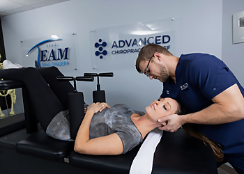 Dr. Tristan Wendt, DC - Houston, TX Chiropractors - Doctor With Patient Image