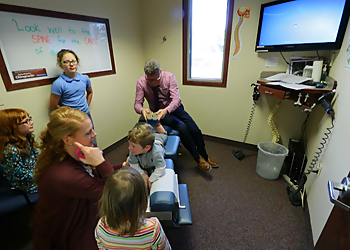 Dr. William Goss, DC - Sterling Heights, MI Chiropractors - Doctor With Patient Image