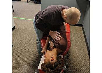 Aurora Chiropractors Dr. Zac Cummins, DC- INFINITY WELLNESS CENTER