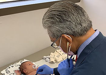 Gerard Edralin, MD - Palmdale, CA Pediatricians - Doctor With Patient Image
