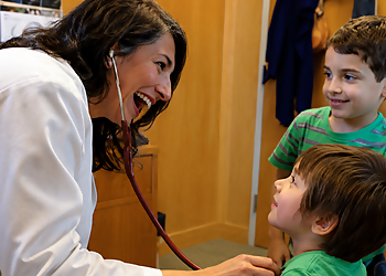 Gulrukh Rizvi, MD - Eugene, OR Primary Care Physicians - Doctor With Patient Image