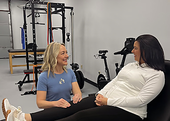 Heather Smith, DPT, OCS - AUREUM PHYSIO - Cary, NC Physical Therapists - Doctor With Patient Image