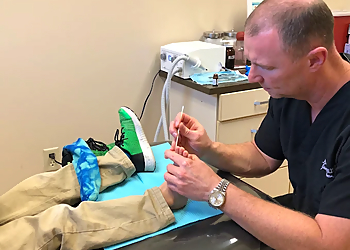 James Washburn, DPM - St Petersburg, FL Podiatrists - Doctor Working Image