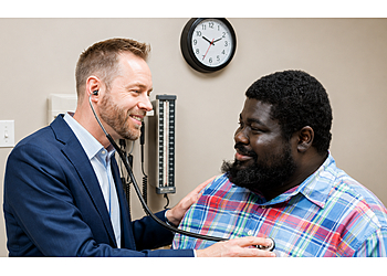 Jason Michael Leonard, MD - Columbia, SC Primary Care Physicians - Doctor With Patient Image