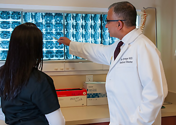 Jay Iyengar, MD - Tacoma, WA Pain Management Doctors - Doctor Working Image