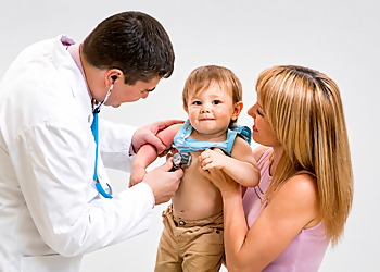 Jemal Omidvar, MD - Alexandria, VA Pediatricians - Doctor With Patient Image