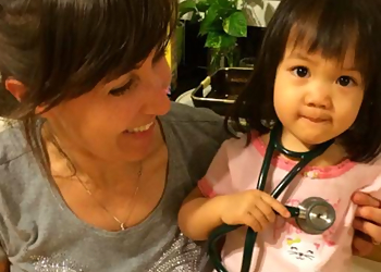 Jenny Welham, MD - Honolulu, HI Pediatricians - Doctor With Patient Image