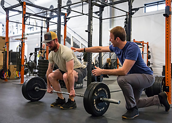 Joe Olofsson, PT, DPT, OCS, USA-W - OLO PHYSICAL THERAPY & WELLNESS - Ann Arbor, MI Physical Therapists - Doctor Working Image