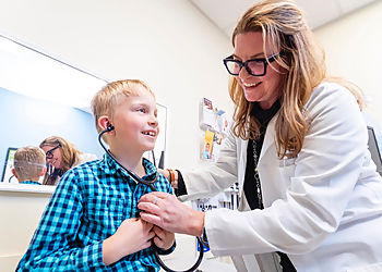 Kimberly Grandinetti, MD, FAAP - Spokane, WA Pediatricians - Doctor With Patient Image