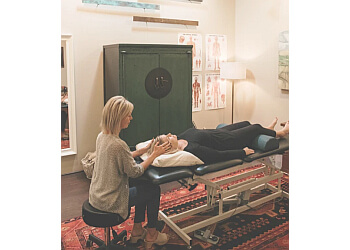 Krysia Witkowski, MPT, CIMT - INTEGRATIVE MANUAL THERAPY & WELLNESS - Norfolk, VA Physical Therapists - Doctor With Patient Image