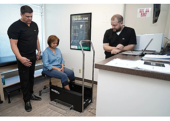 Lewis Mark, DPM - Seattle, WA Podiatrists - Doctor With Patient Image