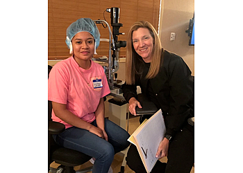 Lori Travers, MD - Raleigh, NC Eye Doctors - Doctor With Patient Image