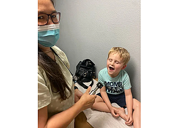 Maria Teresita M. Santos, MD - Henderson, NV Pediatricians - Doctor With Patient Image