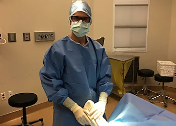 Mark Forman, DPM, MBA, FAPWCA - Scottsdale, AZ Podiatrists - Doctor Working Image