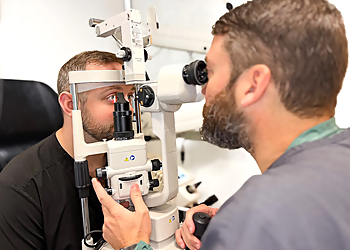 Mark Salopek, OD - THE EYE CENTER CARY - Cary, NC Pediatric Optometrists - Doctor With Patient Image