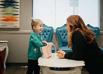 Mitzi L. Hines, DDS - HINES LITTLE SMILES - Columbus, OH Kids Dentists - Doctor With Patient Image