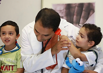 Naveen Mehrotra, MD - Elizabeth, NJ Pediatricians - Doctor With Patient Image