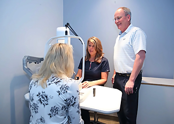 R. Todd Brown, OD - INVISION EYE CARE - Des Moines, IA Pediatric Optometrists - Doctor Working Image
