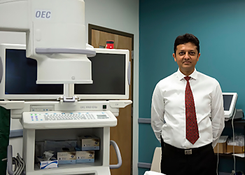 Rajiv Shah, MD - West Valley City, UT Pain Management Doctors - Doctor Working Image