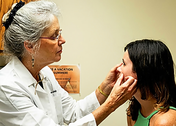 Regina H. Anderson, MD - Baltimore, MD Dermatologists - Doctor With Patient Image