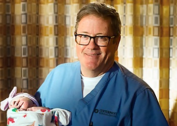 Robert T. Caffrey, MD, FACOG - Independence, MO Gynecologists - Doctor With Patient Image