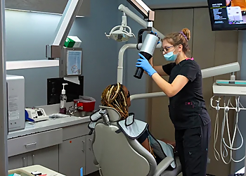 Robert Wesley, DDS -  FAMILY DENTAL GROUP - Flint, MI Orthodontists - Doctor With Patient Image