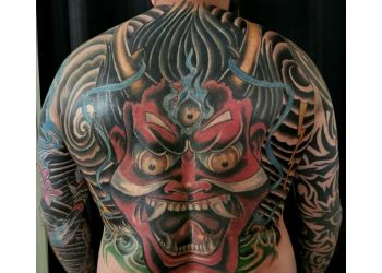 Sacred Tiki Tattoo