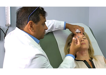 Sanjay Lalla, MD - Newark, NJ Plastic Surgeons - Doctor Working Image