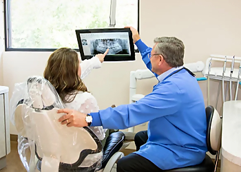 Dr. Stuart Winter, DDS - WINTER DENTAL - Arvada, CO Cosmetic Dentists - Doctor With Patient Image