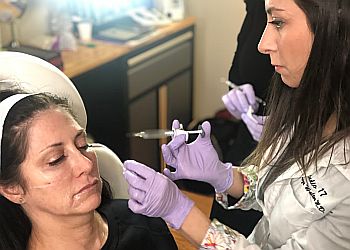 Studio 17 Cosmetics & Wellness Studio 17 Cosmetics & Wellness - Newark, NJ Med Spas - Doctor With Patient Image