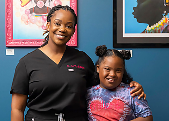 Suffiyah Webb, DDS, MPH - BRILLIANT SMILES PEDIATRIC DENTISTRY - Newark, NJ Kids Dentists - Doctor With Patient Image