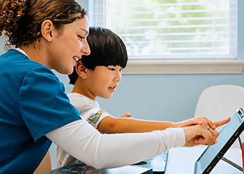 Synaptic Pediatric Therapies - Garland, TX Occupational Therapists - Doctor With Patient Image