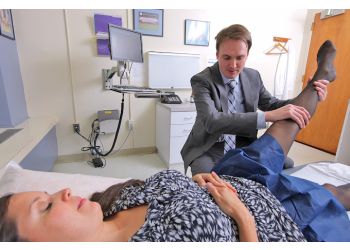 T Sean S Lynch, MD - Detroit, MI Orthopedics - Doctor With Patient Image