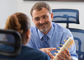 Tom Macek, MD - Fort Lauderdale, FL Pain Management Doctors - Doctor With Patient Image