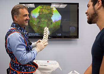 Tom Macek, MD - Fort Lauderdale, FL Pain Management Doctors - Doctor Working Image