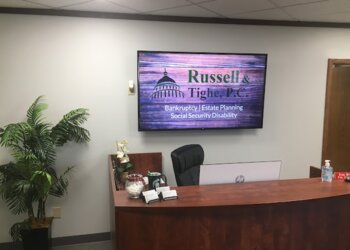 Grand Rapids Bankruptcy Lawyers Travis T. Russell - RUSSELL, TIGHE & ALEXANDER, P.C.
