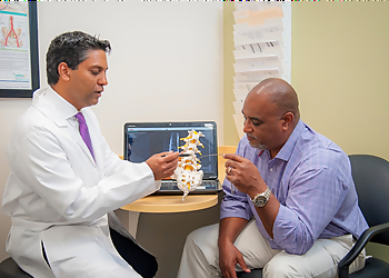 Vijaysinha Mandhare, MD - Cary, NC Pain Management Doctors - Doctor Working Image