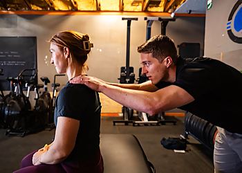 Zachary Tittle, PT, DPT - SPOTLIGHT PHYSICAL THERAPY - Garland, TX Physical Therapists - Doctor With Patient Image